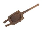 an old iron shovel with a wooden handle on a white background