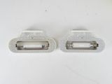 pair of white plastic door handles for a car or truck