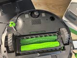 a robot that is sitting on a table next to a computer