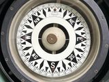 a close up of a compass on the side of a vehicle