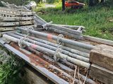 a pile of wood that is sitting in the grass