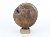 a metal object that is sitting on a white surface