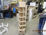 a stack of cardboard boxes sitting on a cart in a warehouse