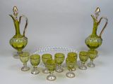 a lot of green glass items that are on the table