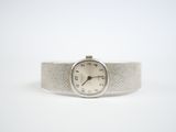 an image of a wrist watch sitting on top of a white surface