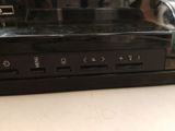 a close up of a remote control on top of a dvd player
