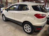 the rear end of a white ford eco - cross parked in a garage