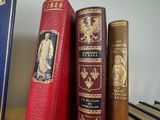 three books that are sitting on a shelf next to each other