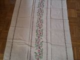 an image of a white table runner with pink flowers on it