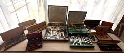 a table that has a bunch of silverware on it