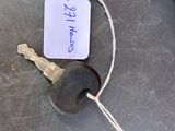 a picture of a car key and a tag on a table