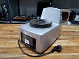 a small machine that is sitting on a wooden table