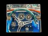 a picture of a picture of a car dashboard with a steering wheel