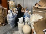 a pile of boxes and other items in a warehouse