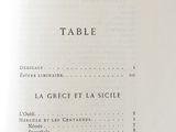 a menu for a restaurant on a table in the middle of a book