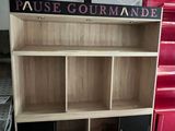 bookshelf made of wood with black and red doors and shelves