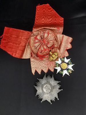 a red ribbon with a star and a star on it