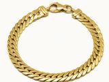 un bracelet en or sur fond blanc