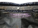 a close up of a black jacket with a purple label on it