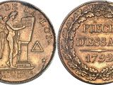 a coin with the image of a man holding a flag on it
