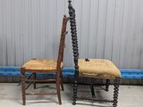 pair of antique wooden chairs with cane back and seat cushions