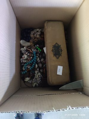 a cardboard box with a bunch of items inside of it