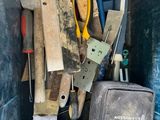 many different tools in the back of a truck