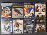 several video games are lined up on a black surface