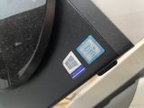 a close up of a black and silver device with a blue sticker on it