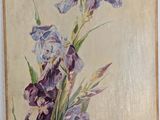 painting of purple flowers in a vase on a white wall