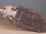 a piece of chocolate sitting on top of a wooden table