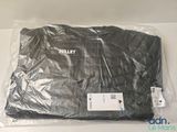 a black shirt wrapped in plastic on a white table
