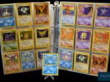 a close up of a binder with a bunch of cards on it
