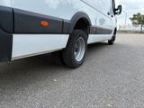 a white van that is parked in the parking lot