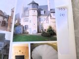 an open book with pictures of a house in it