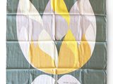 a flag with a flower on it on a white background