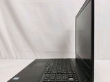 the back of a laptop computer sitting on top of a white table
