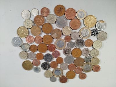 a lot of coins that are on the table
