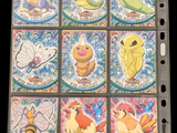 a lot of different pokemon cards on the table
