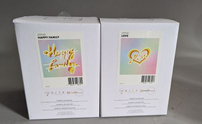 two boxes of happy easter cards sitting on a table