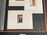 a picture of a collection of stamps on display on a table