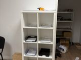a room with a desk and a bookcase in it
