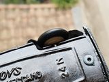 a close up of a mailbox on a street corner