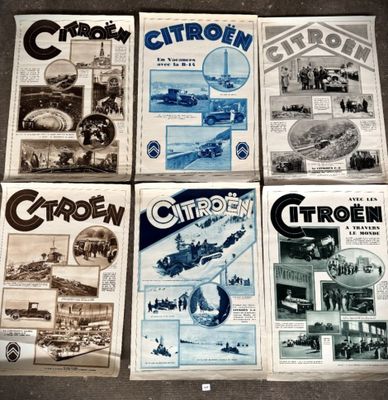 several magazines of different types and sizes are on a table