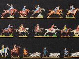 de nombreuses figurines représentant des personnes à cheval et des chevaux