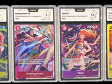 several cards of different colors and designs on a black background