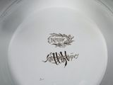 a white plate with a black and white design on it