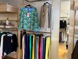 a picture of a clothing store with a variety of clothes