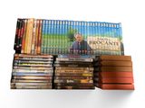 many dvds stacked on top of each other on a shelf