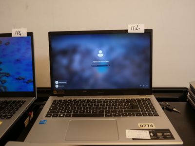 two laptops that are sitting on a desk